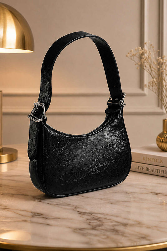 Sac à bandoulière en cuir verni noir