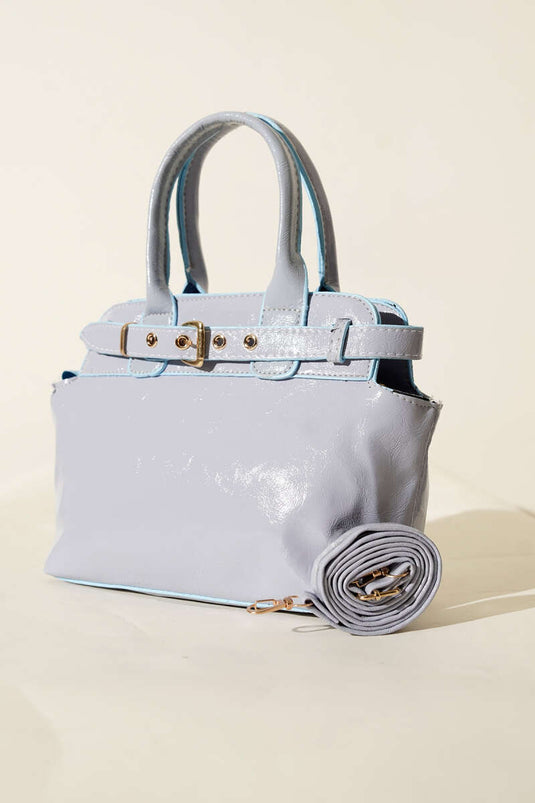 Dettaglio clip per cintura Borsa lucida blu bambino