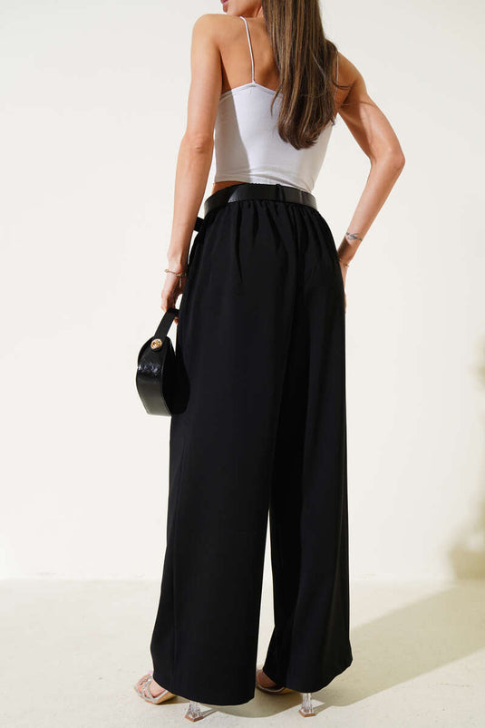 Pantalones casuales de pierna ancha con cinturón negros