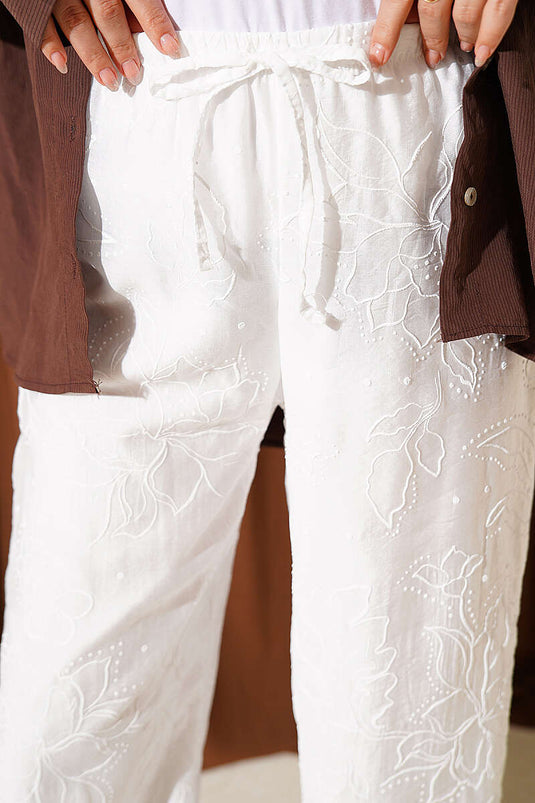 Pantalon blanc à taille élastique et motif intégré