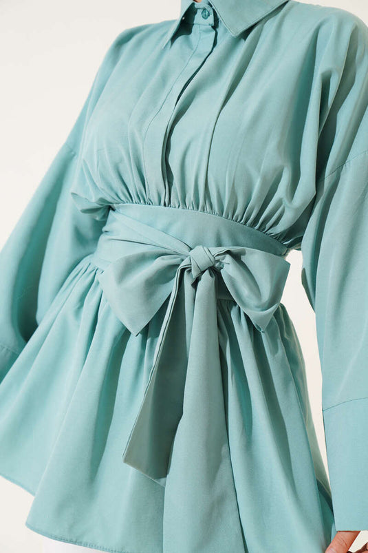 Self-belted, front-gathered tunic in mint color.