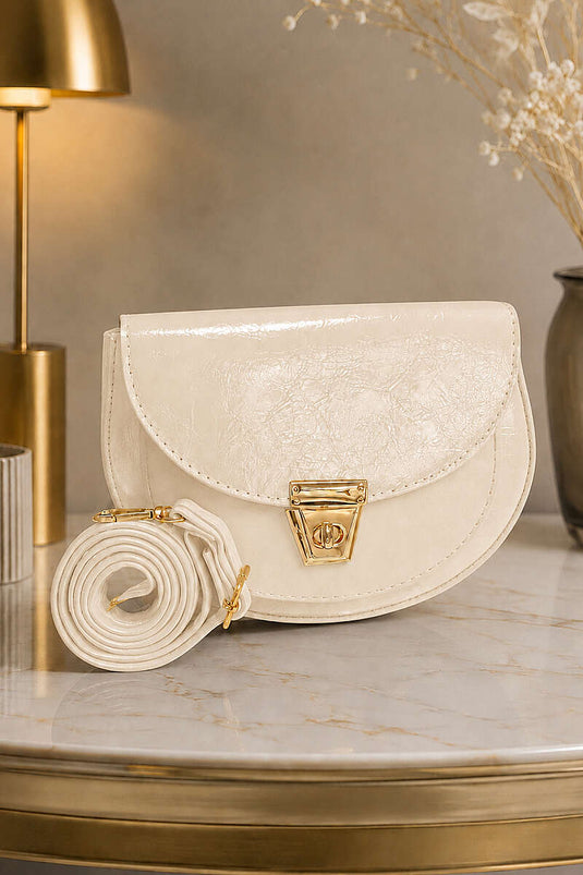 Sac ovale en cuir verni avec détail de fermeture crème