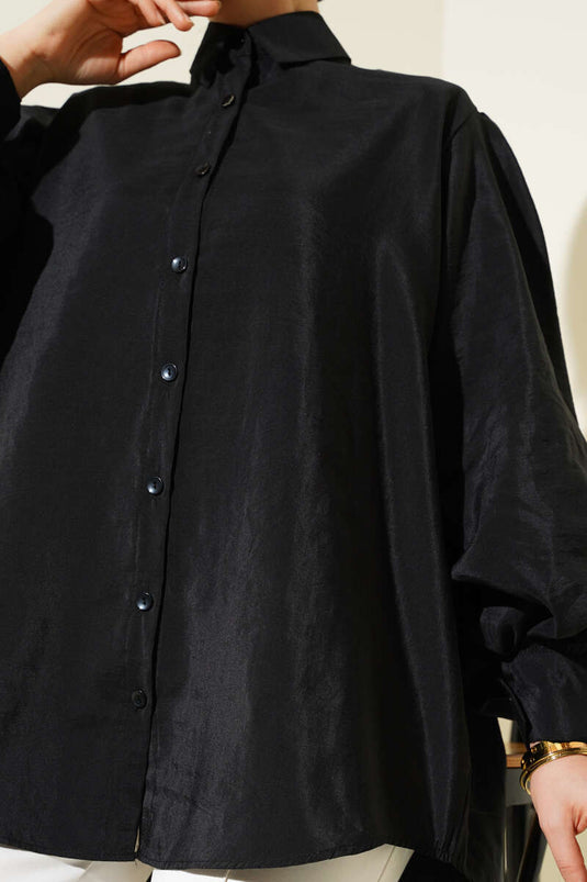 Chemise noire à manches ballon et texture froissée