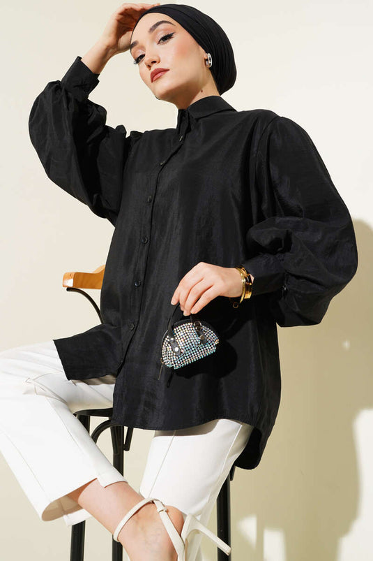 Chemise noire à manches ballon et texture froissée