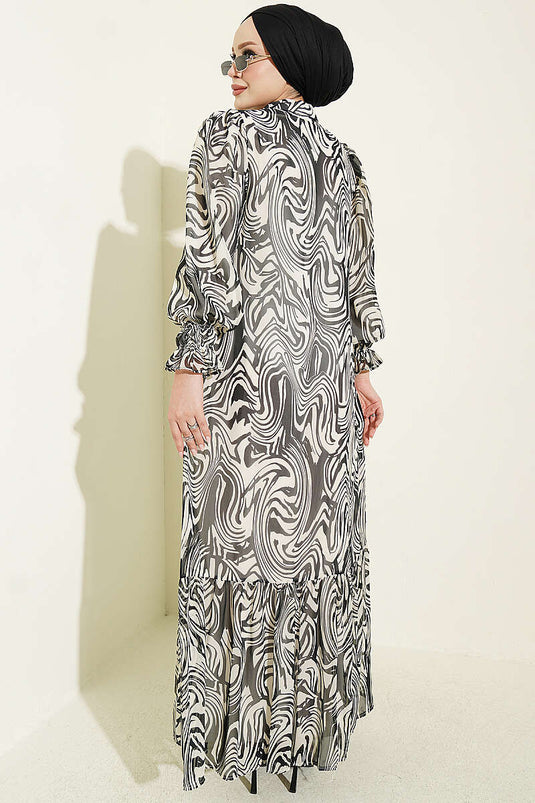Schwarzes Chiffon-Kleid Mit Muster Und Rüschenkragen