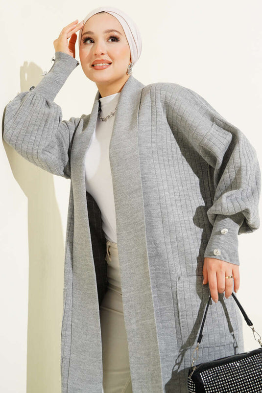 Cardigan tricoté à col châle et manches boutonnées en gris