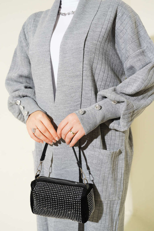 Cardigan tricoté à col châle et manches boutonnées en gris