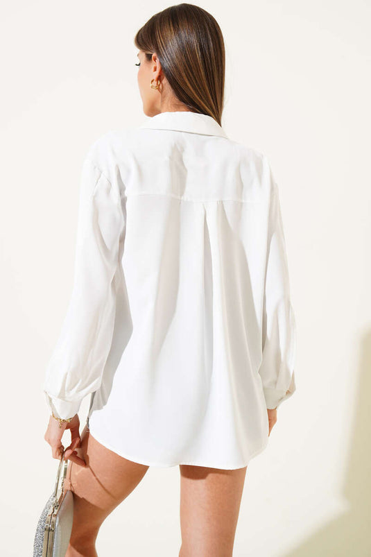 Chemise blanche en mousseline à manches fendues