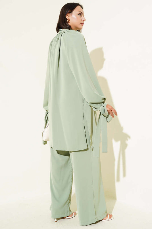 Abito due pezzi con maniche annodate, verde mandorla