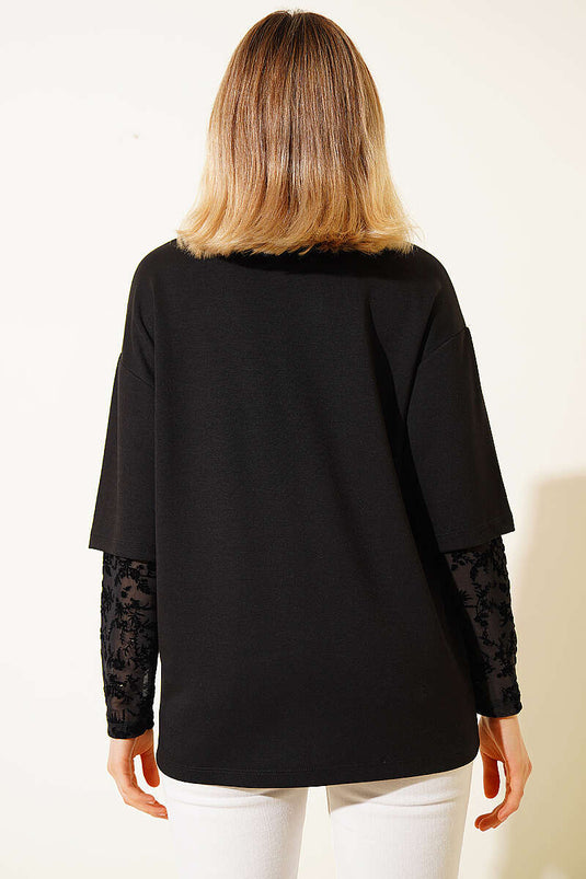 T-shirt noir avec manches ornées de dentelle