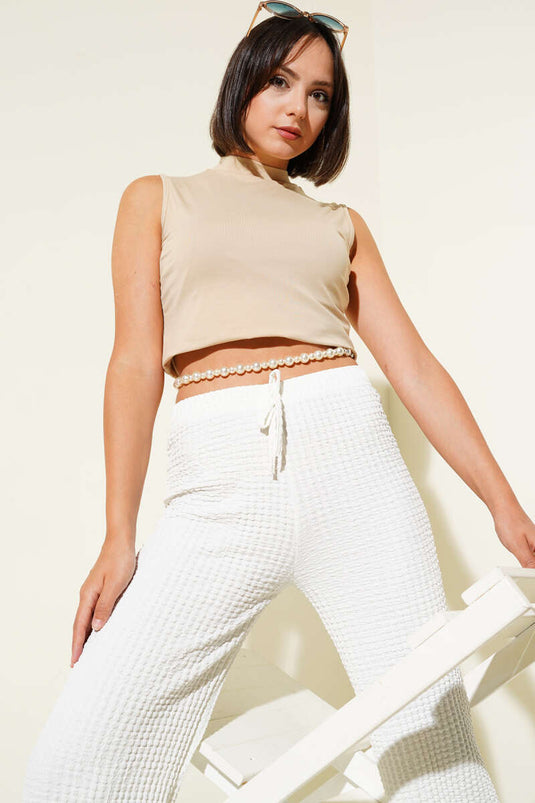 Body senza maniche con collo alto beige