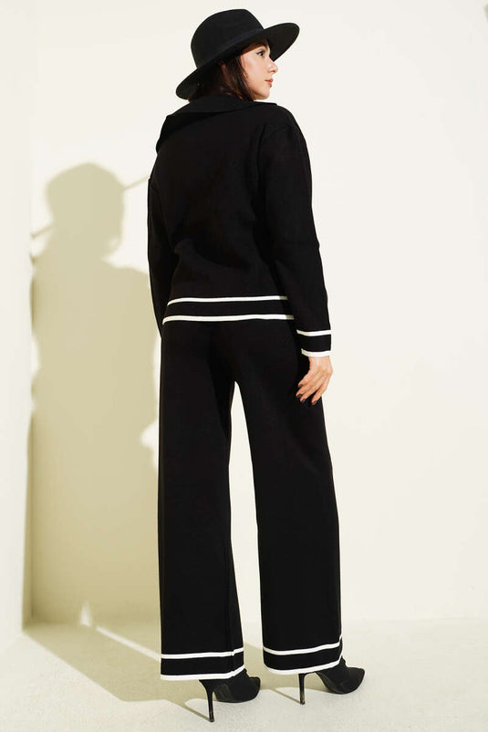 Schwarzer, zweireihiger Strickanzug mit Knopfleiste