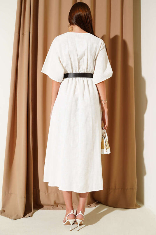 Vestido midi de lino con cinturón y cuello cruzado, color crudo