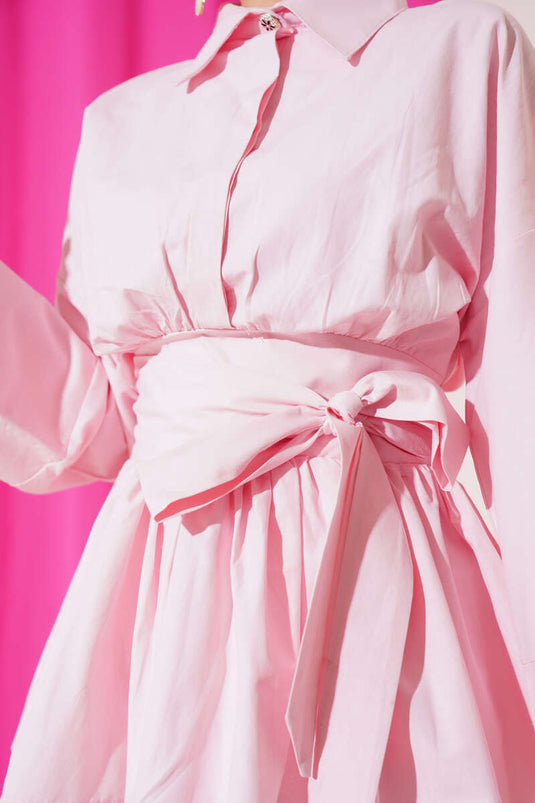 تونيك وردي بنصف أزرار وحزام مكشكش