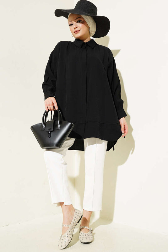 Chemise noire à poignets plissés et poignets boutonnés