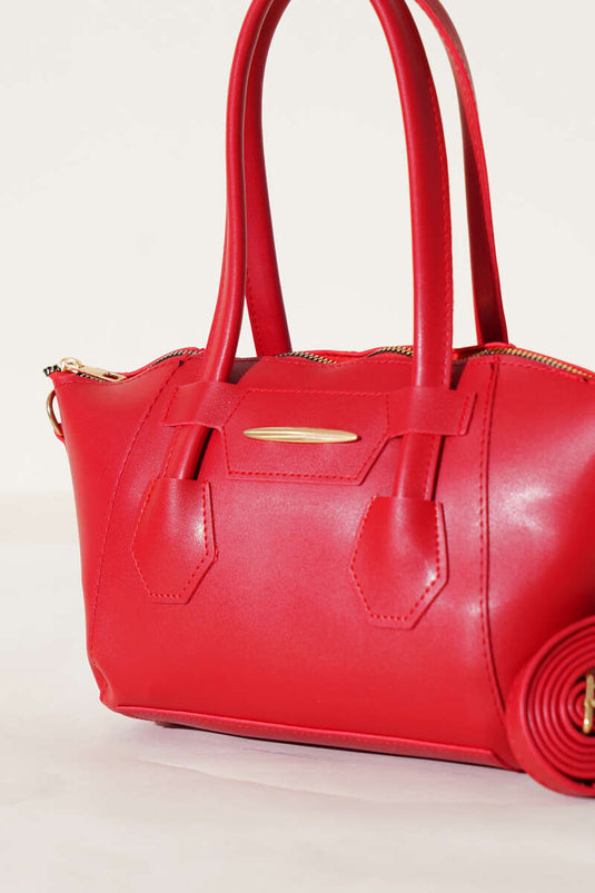 Sac à fermeture éclair rouge avec emblème métallique