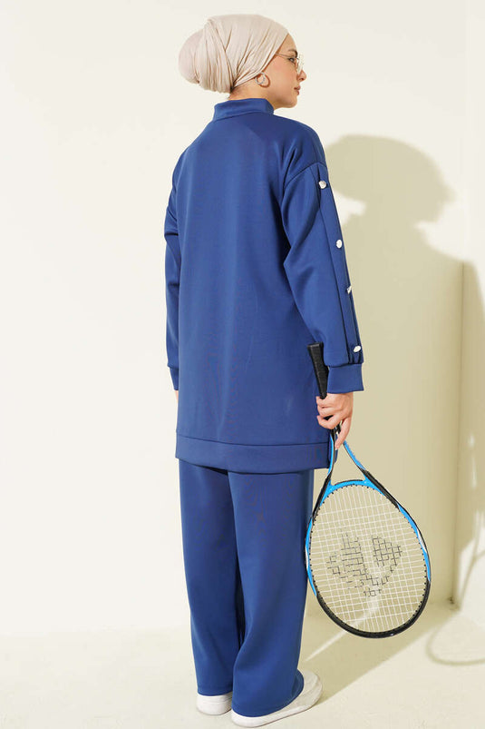 طقم غوص أزرق داكن من قطعتين بأزرار معدنية وسحاب