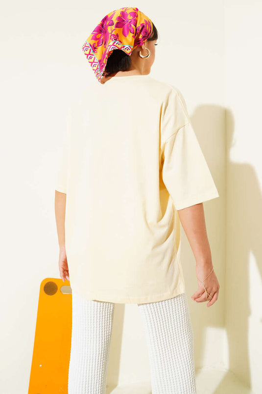 تيشيرت أصفر مطرز بفيونكة صغيرة