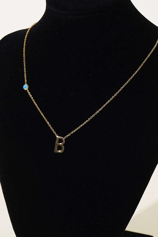 Collier de lettres perlées mauvais œil B