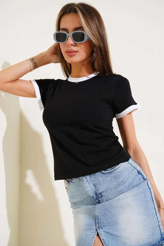 Schwarze Bluse mit Schulterknöpfen