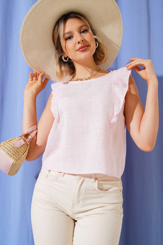 Rosa Bluse mit Rüschen an den Schultern