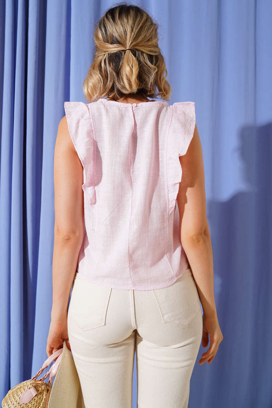 Rosa Bluse mit Rüschen an den Schultern