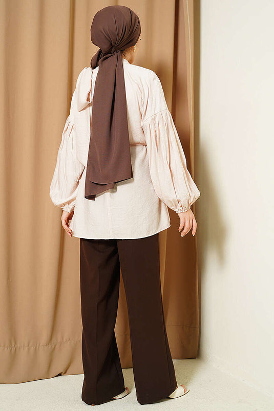 Tunique ample beige avec nœud à l'épaule