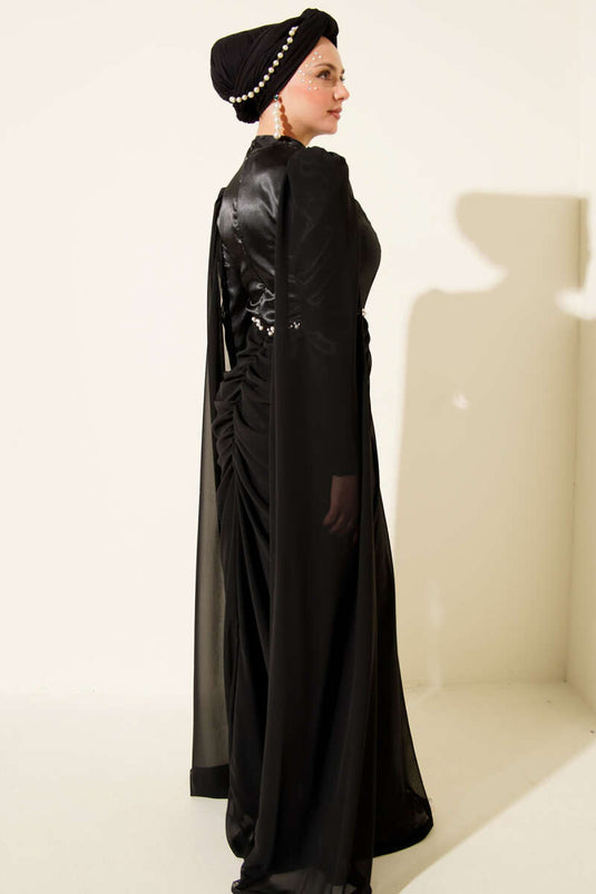 Abito da sera con spalle scoperte e dettagli in pietra, nero