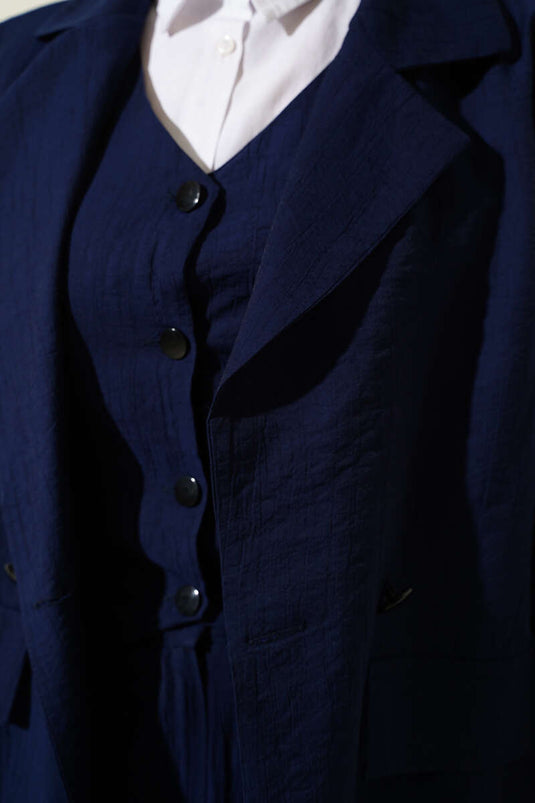 Navy Blue Three-Piece Set with Shoulder Pads, Jacket, and Vest