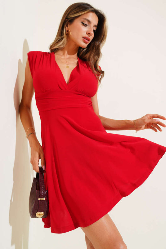 Rode mini-jurk met schoudervullingen