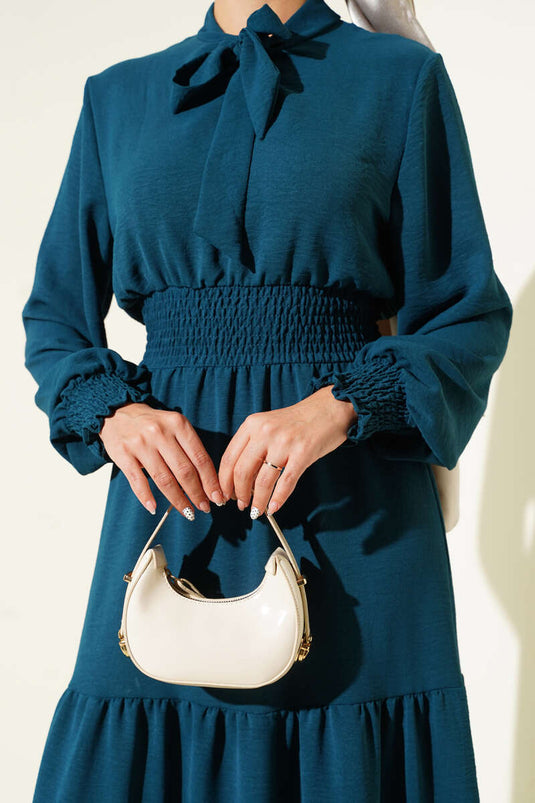 Jurk met strikdetail aan de voorkant en elastische tailleband, petrolgroen