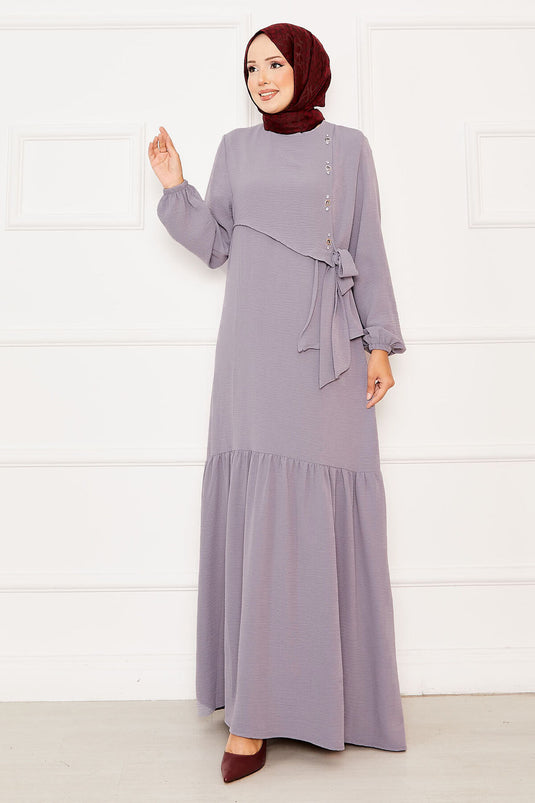 Graues Kleid zum Binden mit Aller- und Steindetail auf der Vorderseite