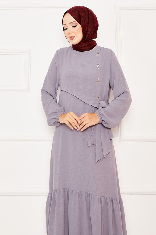 Graues Kleid zum Binden mit Aller- und Steindetail auf der Vorderseite