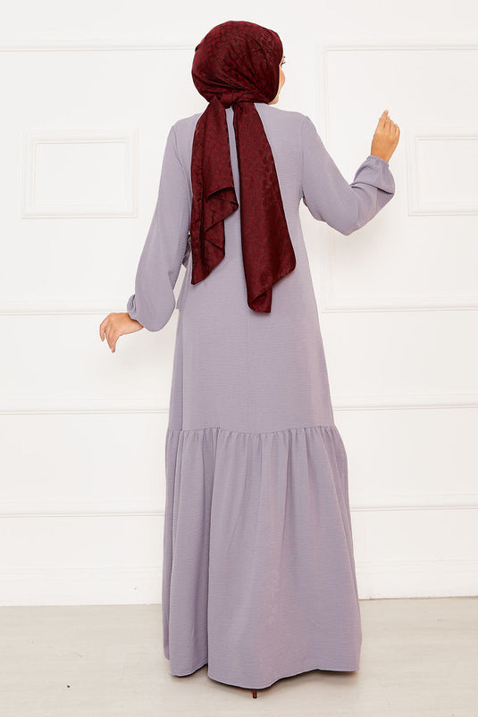 Graues Kleid zum Binden mit Aller- und Steindetail auf der Vorderseite