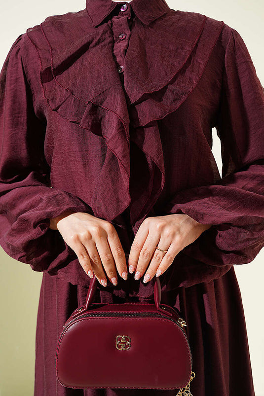 Ensemble deux pièces avec blouse à volants et jupe, couleur mûre