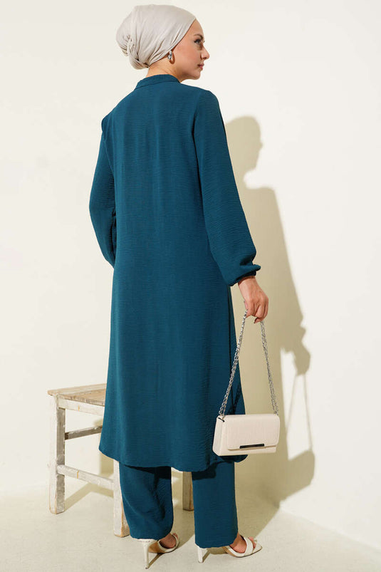 طقم مكون من قطعتين بتفاصيل حجر أمامية مكشكشة باللون البترولي