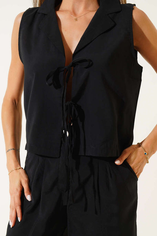 Two-piece set with drawstring front and vest, black.