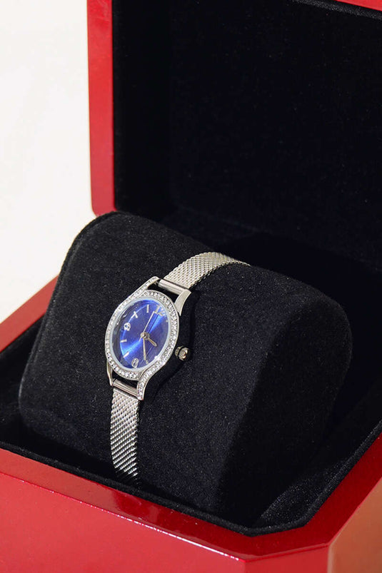 Montre-bracelet pour femme avec pierre à cadre ovale bleu marine