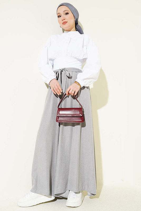 Pantaloni oversize con risvolto e cintura grigi