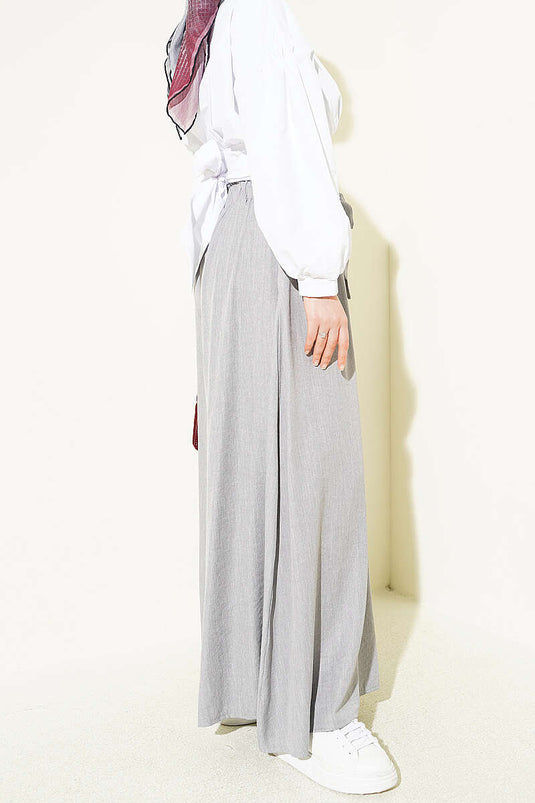 Pantaloni oversize con risvolto e cintura grigi