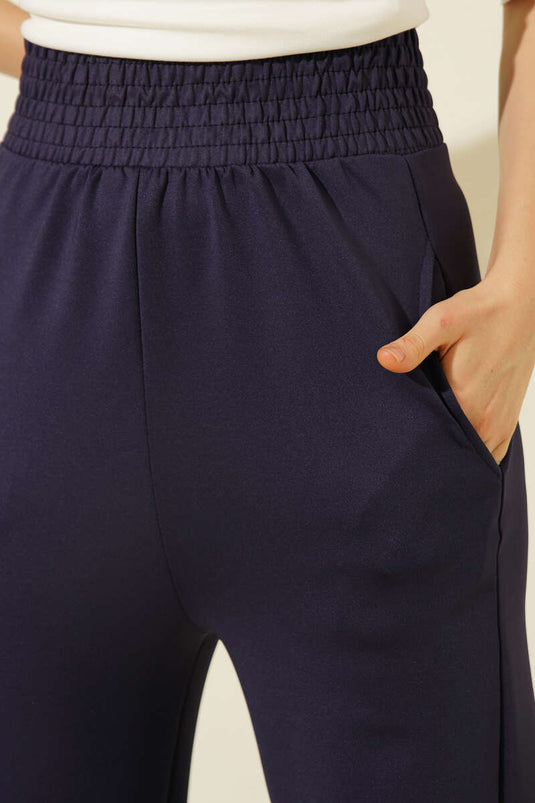 Pantalon en scuba bleu marine avec poches et taille élastiquée