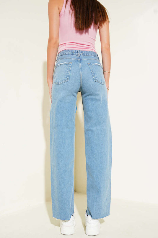 بنطلون جينز بالازو أزرق اللون بحافة مزينة بشرابات