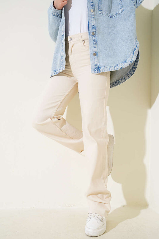 Pantalon en jean Palazzo à pompons Stone