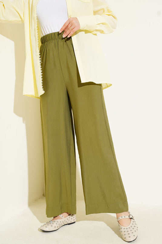 Pantalon en tissu brillant vert amande
