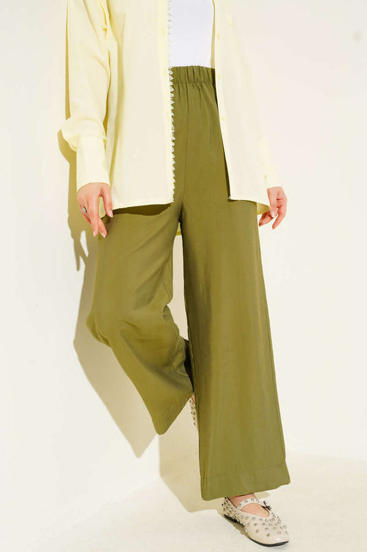 Pantalon en tissu brillant vert amande