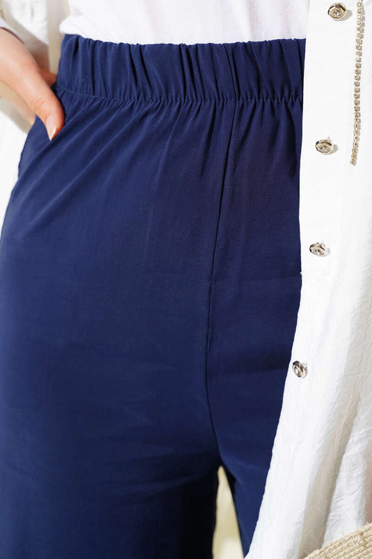 بنطلون قماشي لامع باللون الأزرق الداكن