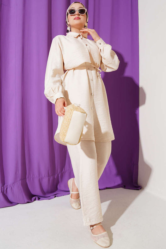 Ensemble deux pièces beige avec capuche et cordon de serrage