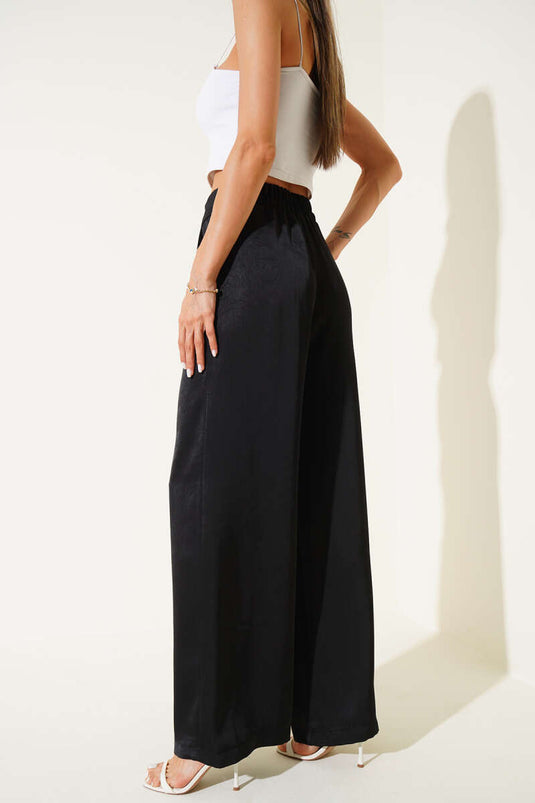 Pantalon ample plissé en satin noir