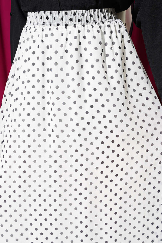Gonna in chiffon bianca con motivo a pois