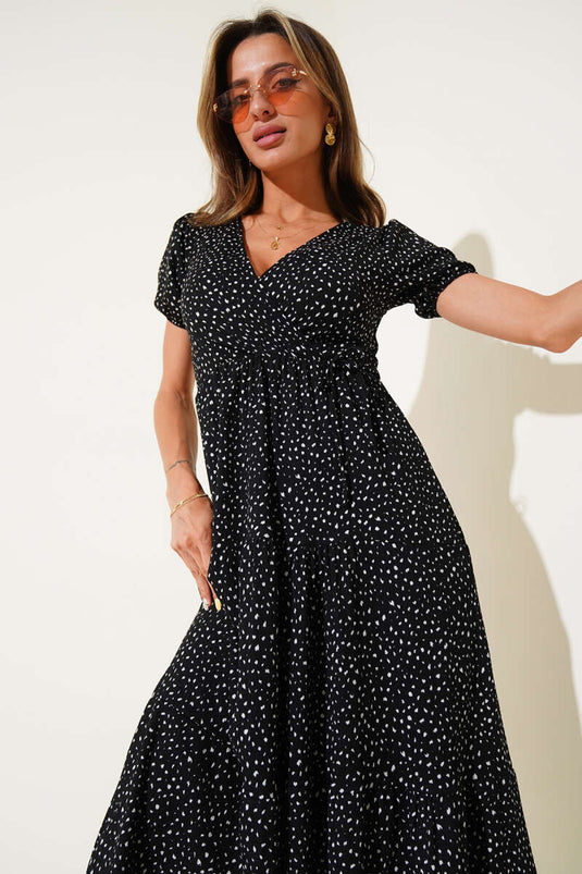 Schwarzes Midikleid mit Polka-Dots, elastischem Bund und V-Ausschnitt